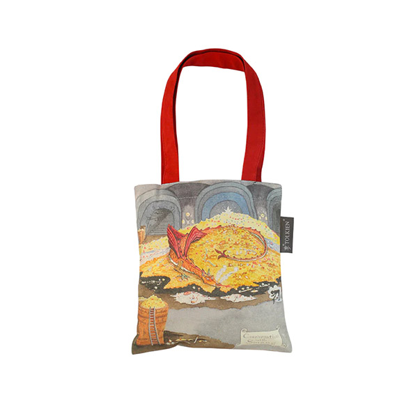 A tote bag with a red handle showing an illustration by JRR Tolkien of a dragon on a heap of gold