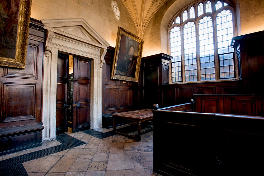 A wood-panelled room with dark wood furnishings