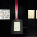 Four manuscripts displayed upright in a page, the one on the left is an illustrated map showing Lyra's Oxford from Philip Pullman's Northern Lights series