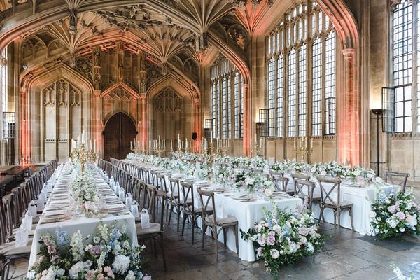 Three long tables with white table cloths in the Divinity School at Bodleian Library
