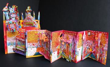 A brightly coloured paper concertina covered in drawings and text